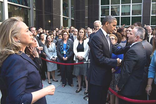 President Barack Obama greets State Department employees after Chris Stevens, U.S. Ambassador to Libya, and three others had been killed in Benghazi, Libya, on Sept. 11. Secretary of State Hillary Rodham Clinton stands at left.