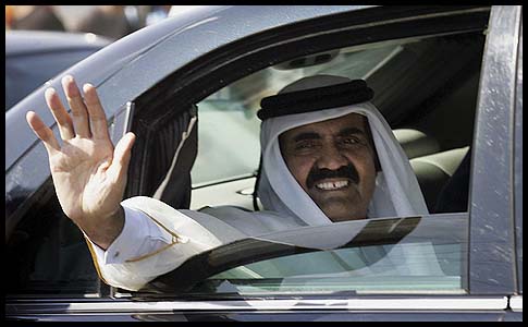 Qatari Emir Sheikh Hamad bin Khalifa al-Thani waves to the crowds at the Rafah border crossing with Egypt, Tuesday.