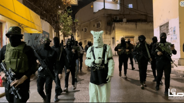 Fighters of the Jenin Battalion, affiliated with the Palestinian Islamic Jihad with a suicide bomber leading them