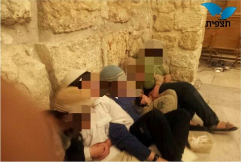 Youths chain themselves together in David's Tomb, in protest. Photo by: Tazpit News Agency