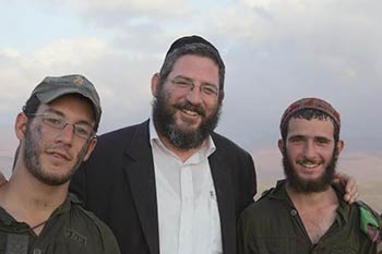 Rabbi Dov Fuchs (center) of the Nahal Haredi Foundation.