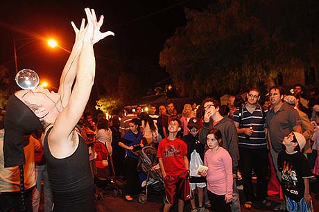 A street performer at a festival on Emek Refaim street in the center of Jerusalem A street performer at a festival on Emek Refaim street in the center of Jerusalem