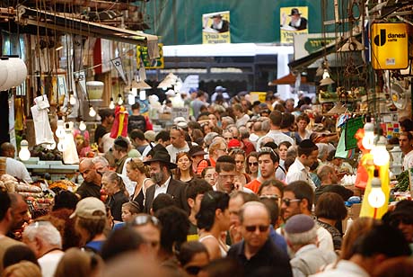 Israelis shop for food at the Mahane Yehuda market in Jerusalem. Israelis shop for food at the Mahane Yehuda market in Jerusalem.