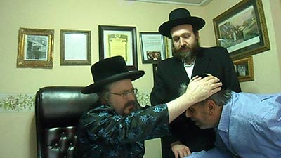Biala Rebbe blesses a visitor in Florida.