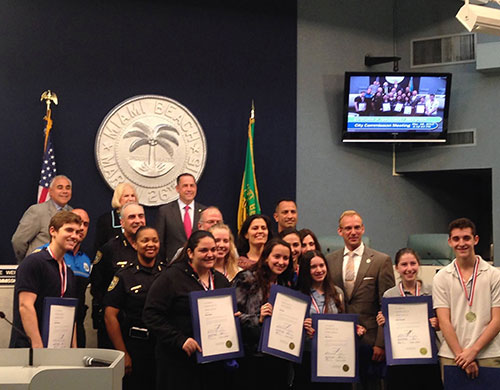 Hebrew Academy JUMP Team, teacher Oshrat Twito, Miami Beach city commissioners, and Captain Acosta of the City of Miami Beach Police Department.