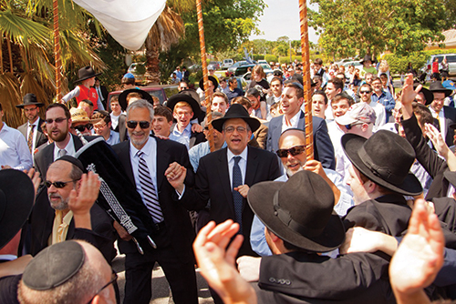 Community members accompany new Torah to the Young Israel of Boca Raton.