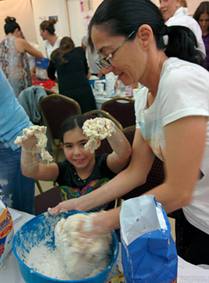 Participants enjoy baking challah at Highland Lakes Jewish Center.