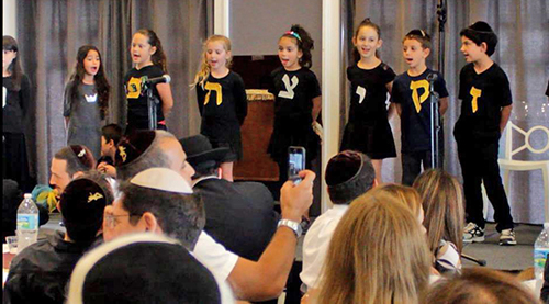 Students perform at the CHAPS end-of-year dinner.