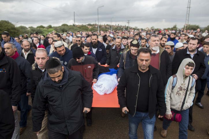 Family and friends carrying the body of 4-year old Adele Biton 