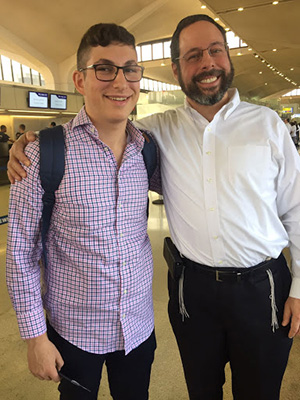 Father and son at the airport.