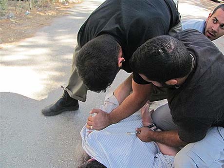 Beaten and cuffed, no warrant