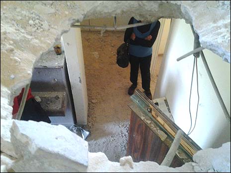 Rocket Hole2 A Gaza rocket left a gaping hole in the floor and ceiling of the Leibovitzs' Ashkelon apartments.