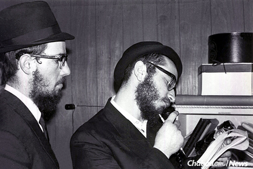 Wolff, right, and Chaim Baruch Halberstam working on the January broadcast. (Photo: Mulik Rivkin Archive)