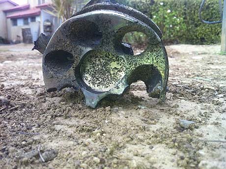Remains of a rocket explosion near a residential home in Israel's south. Daniel Hagbi, Sderot Media Center.