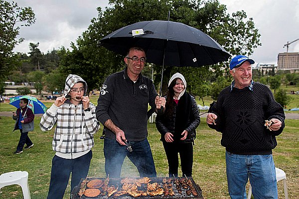 Neither rain nor wind will stay Israelis from their BBQ (mangal) on Yom Ha'Atzmaut,.